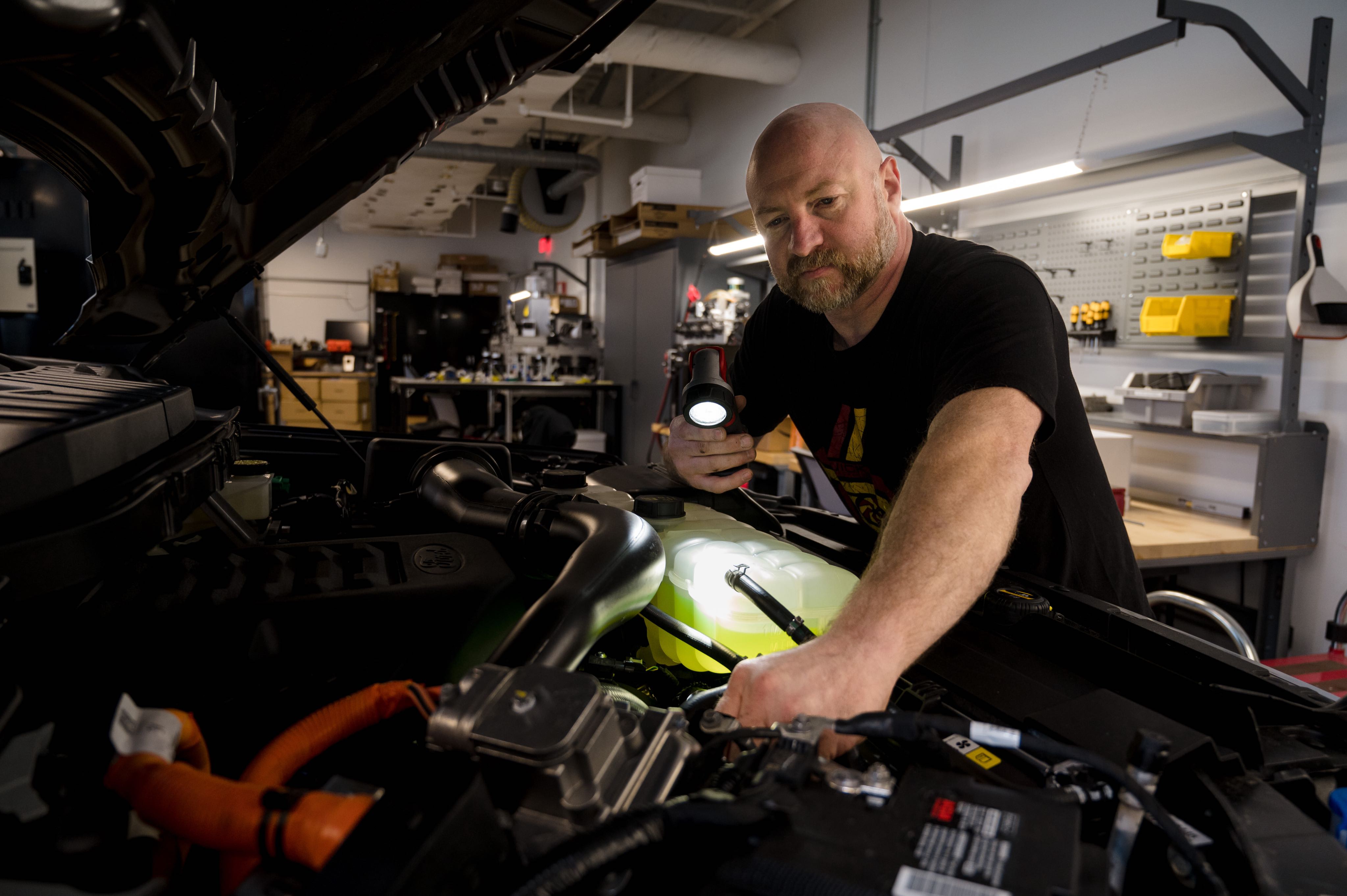 Man working on test vehicle